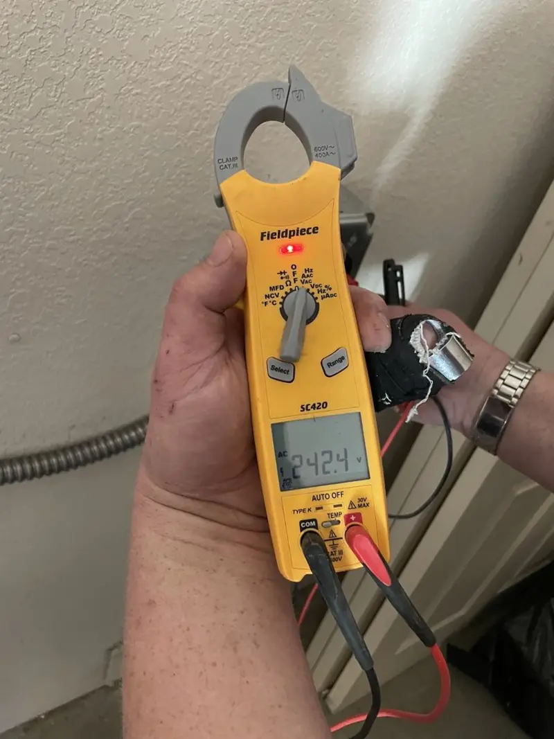 Voltage testing with clamp meter during Outlet Installation in Westview